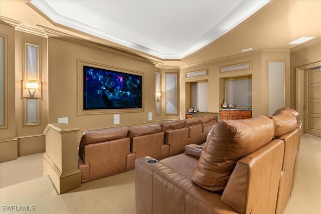 4951 Bonita Bay Blvd Unit 2205, Bonita Springs, FL 34134 - home theater featuring light carpet, crown molding, and a tray ceiling