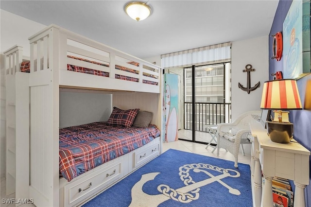 tiled bedroom featuring access to exterior