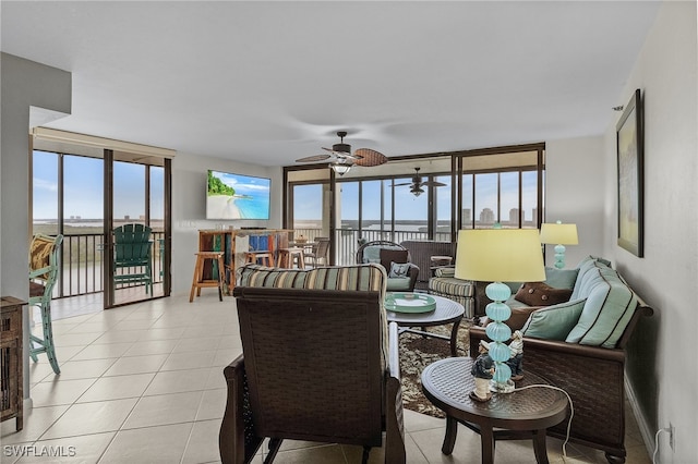 sunroom featuring ceiling fan and a wealth of natural light