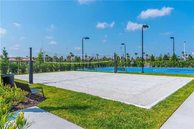 view of property's community featuring volleyball court, a yard, tennis court, and basketball hoop