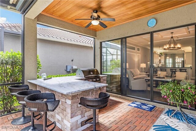 view of patio / terrace with a bar and grilling area