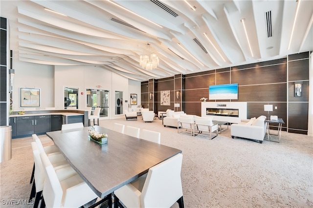 dining space featuring lofted ceiling and an inviting chandelier