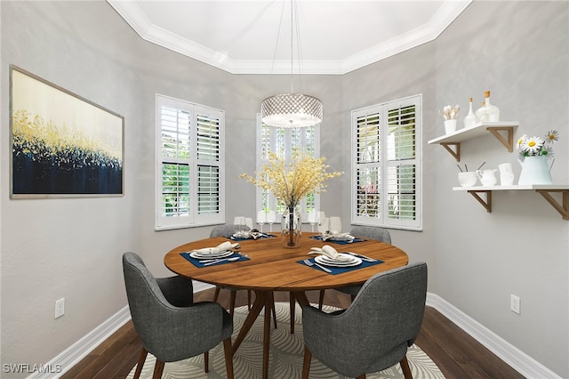 dining area featuring crown molding and hardwood / wood-style flooring