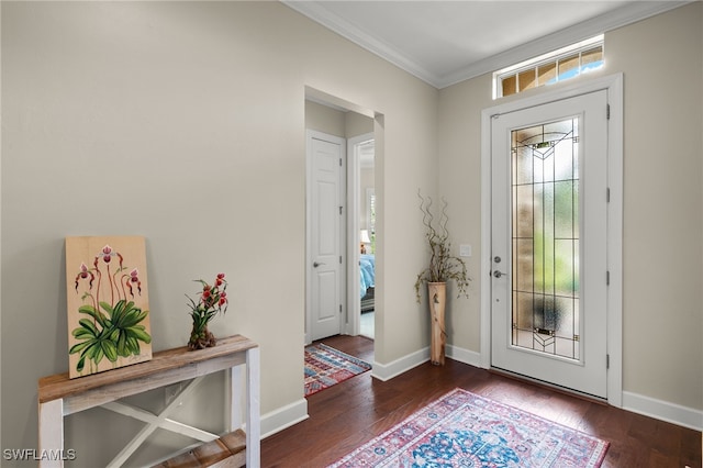 entryway featuring dark wood-type flooring and ornamental molding