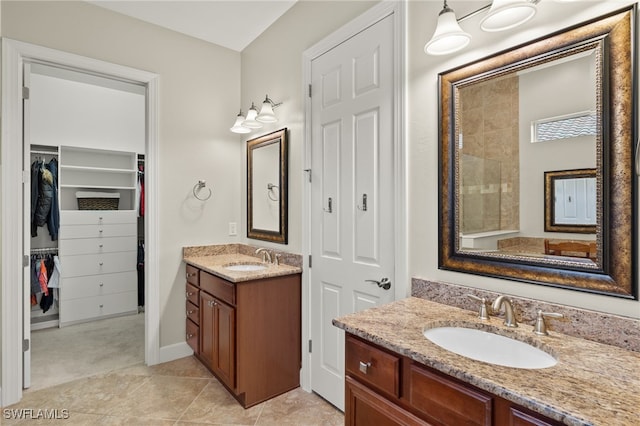 bathroom featuring tile patterned flooring and vanity