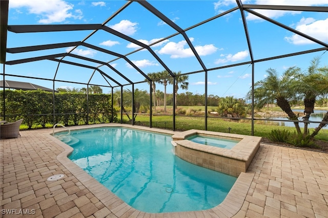 view of pool featuring glass enclosure, a patio area, and an in ground hot tub