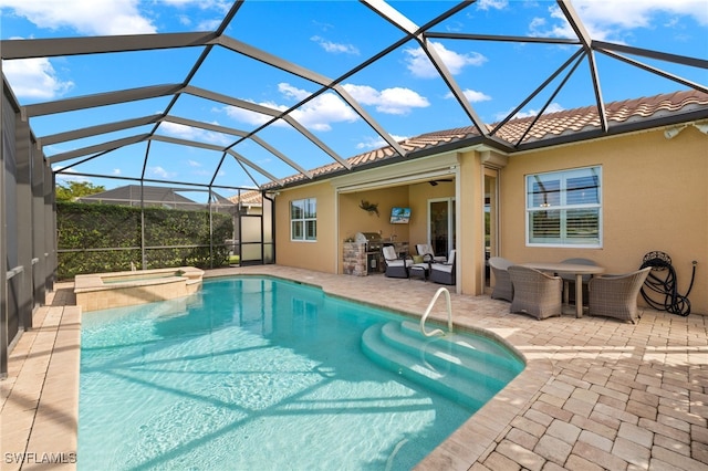 view of swimming pool with a lanai, a patio, and an in ground hot tub