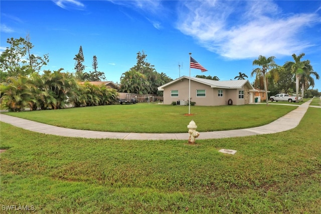 view of home's exterior with a lawn