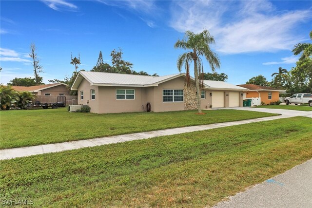 2600 Poinciana St, Naples, FL 34105 - ranch-style house featuring concrete driveway, a garage, stucco siding, and a front lawn