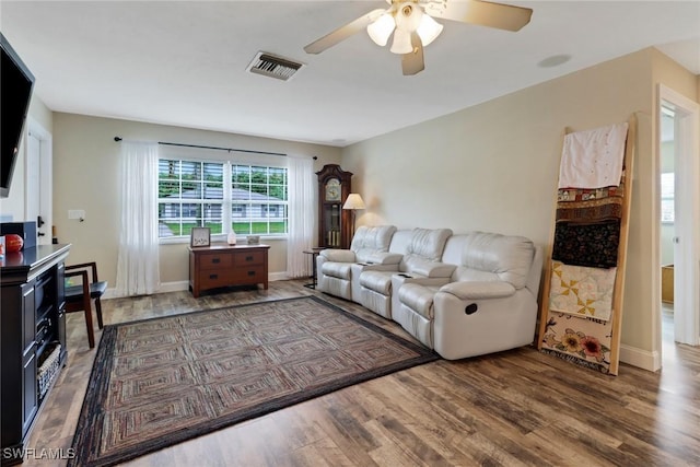 2600 Poinciana St, Naples, FL 34105 - living room featuring ceiling fan, wood finished floors, and baseboards