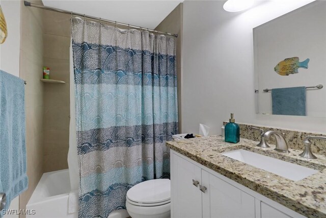 2600 Poinciana St, Naples, FL 34105 - full bathroom featuring vanity, toilet, and shower / bath combination with curtain