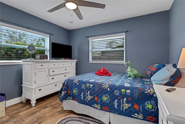 bedroom featuring ceiling fan and light wood-type flooring