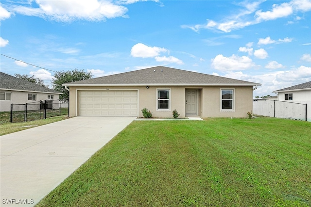 view of front of home featuring a garage and a front lawn