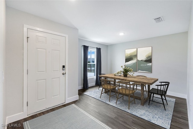 dining space featuring dark hardwood / wood-style flooring