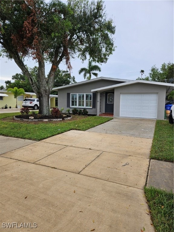 single story home with a front lawn and a garage