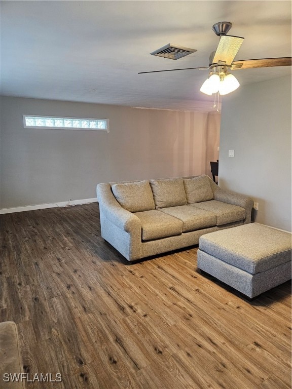 unfurnished living room with ceiling fan and wood-type flooring