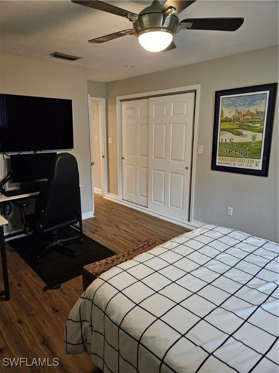 bedroom featuring ceiling fan, a closet, and hardwood / wood-style flooring