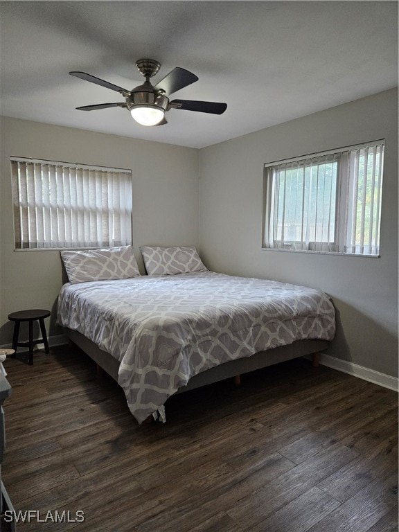 bedroom featuring dark hardwood / wood-style floors and ceiling fan