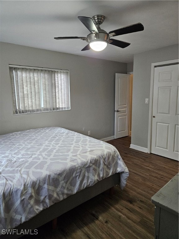 bedroom with ceiling fan and dark hardwood / wood-style floors