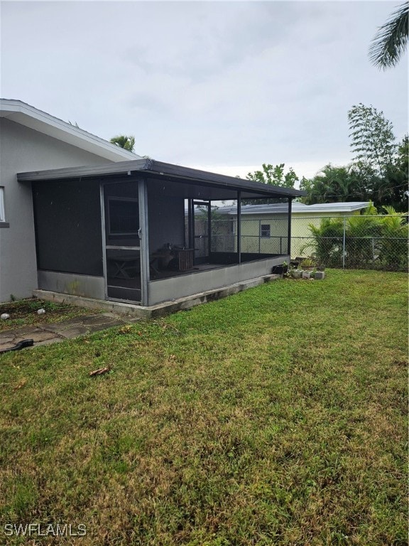 view of yard with a sunroom