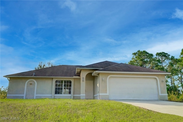 ranch-style house with a front yard and a garage