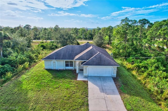 934 Garnet Ave, Lehigh Acres, FL 33974 - view from above of property featuring a forest
