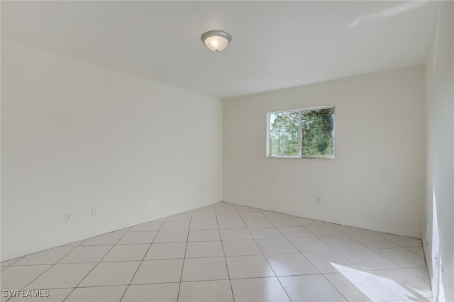 unfurnished room with light tile patterned floors