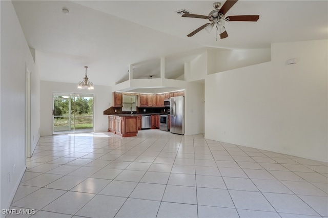 unfurnished living room featuring sink, ceiling fan with notable chandelier, lofted ceiling, and light tile patterned flooring