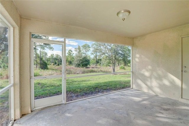 934 Garnet Ave, Lehigh Acres, FL 33974 - unfurnished sunroom featuring healthy amount of natural light