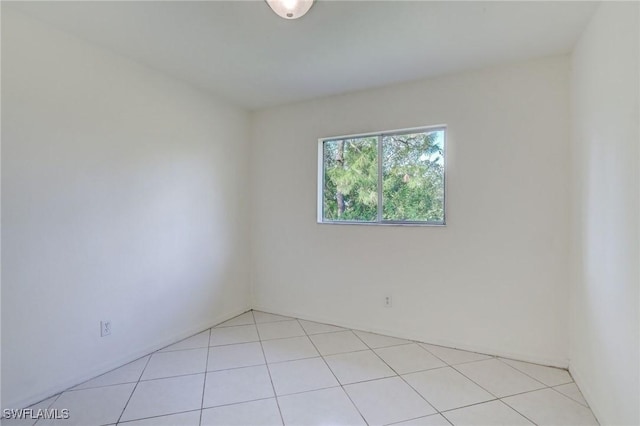 934 Garnet Ave, Lehigh Acres, FL 33974 - unfurnished room with light tile patterned flooring
