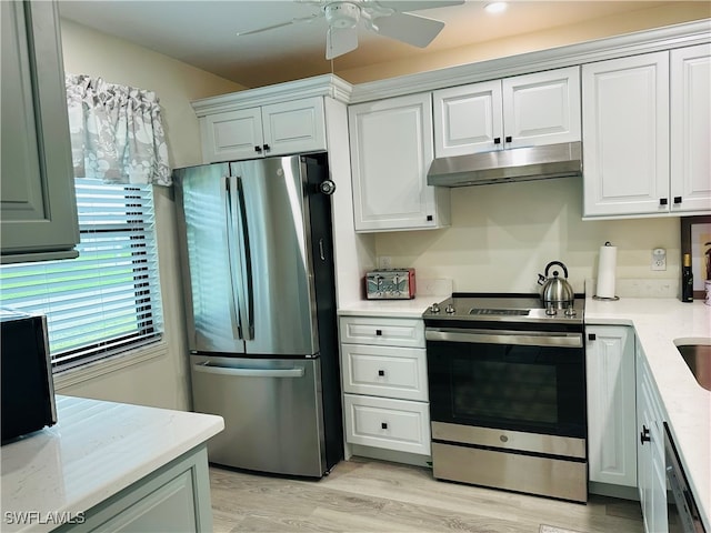 kitchen featuring light hardwood / wood-style flooring, white cabinets, and appliances with stainless steel finishes