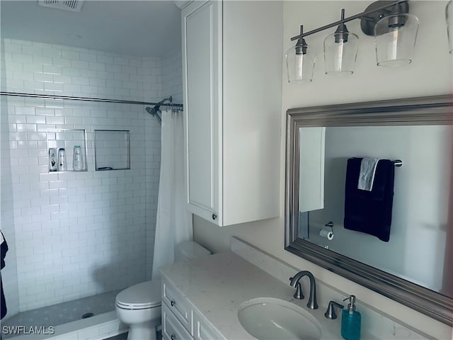 bathroom with vanity, toilet, and a shower with shower curtain