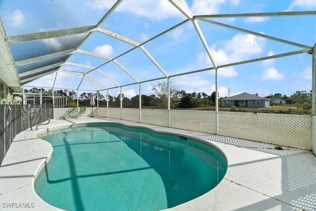 view of swimming pool with a lanai