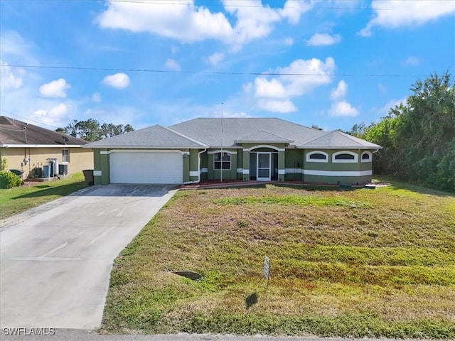 ranch-style house with a garage and a front lawn