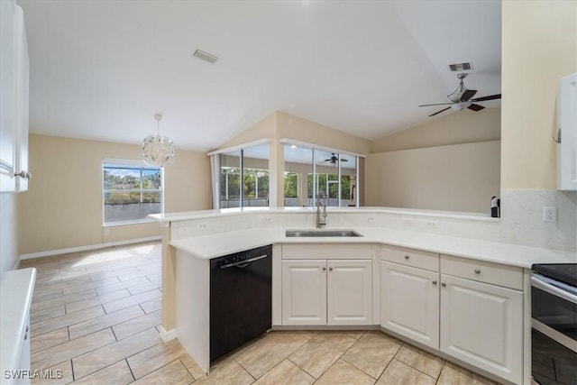 kitchen featuring dishwasher, lofted ceiling, white cabinets, sink, and hanging light fixtures