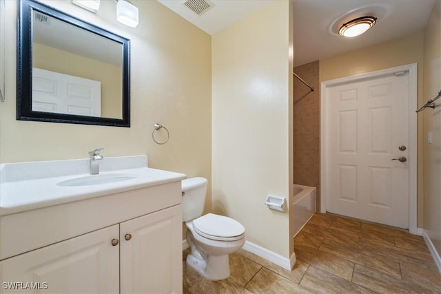 full bathroom featuring vanity, toilet, and tiled shower / bath