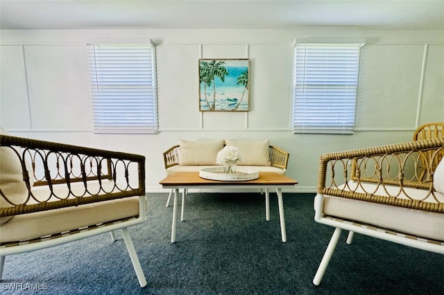 sitting room featuring carpet floors and plenty of natural light