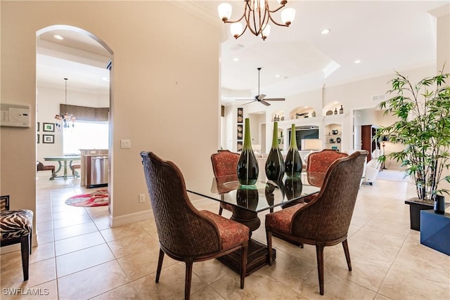 tiled dining room featuring ornamental molding and ceiling fan with notable chandelier