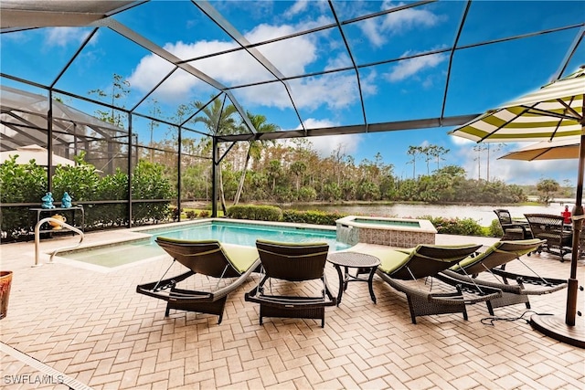 view of swimming pool featuring a lanai, a patio, and an in ground hot tub