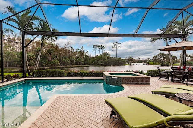 view of swimming pool featuring an in ground hot tub, a water view, a lanai, and a patio