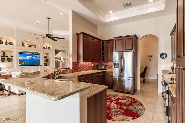 kitchen featuring a breakfast bar, sink, ornamental molding, kitchen peninsula, and stainless steel appliances