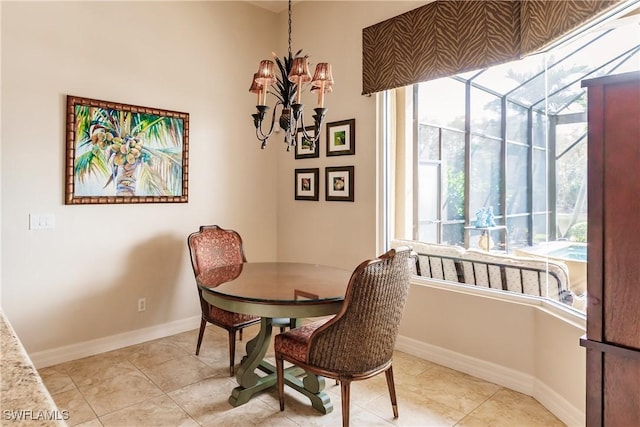 tiled dining space featuring a notable chandelier and a wealth of natural light