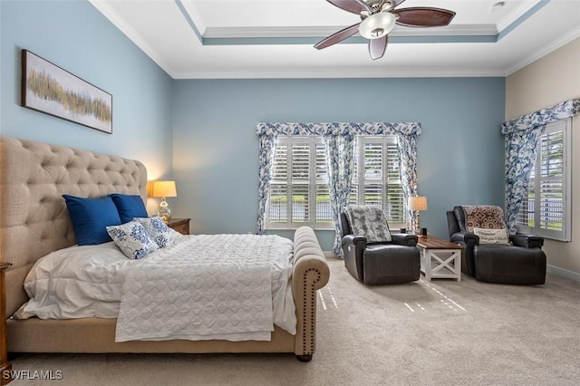 bedroom featuring carpet floors, ornamental molding, and a raised ceiling