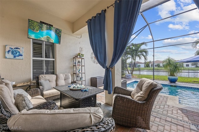 view of patio with outdoor lounge area, a lanai, and a fenced in pool