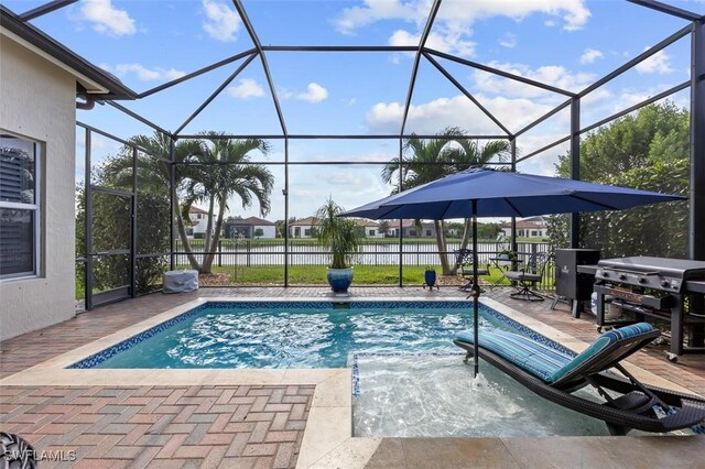 view of pool featuring a lanai, grilling area, and a patio