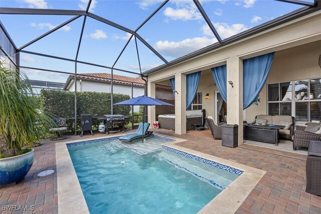 view of pool with an outdoor living space, a patio area, glass enclosure, and a hot tub