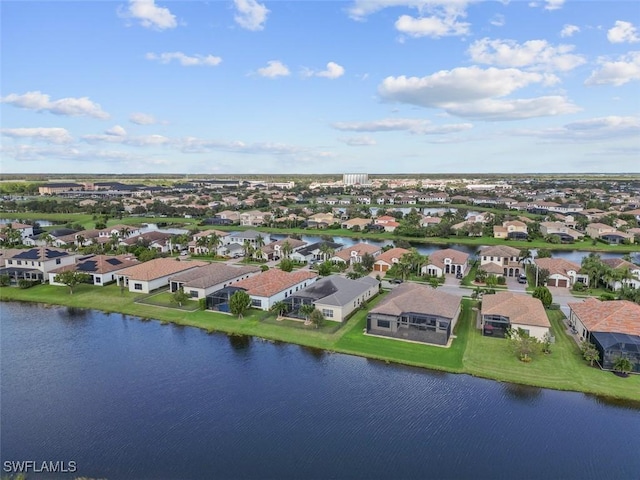 birds eye view of property featuring a water view and a residential view