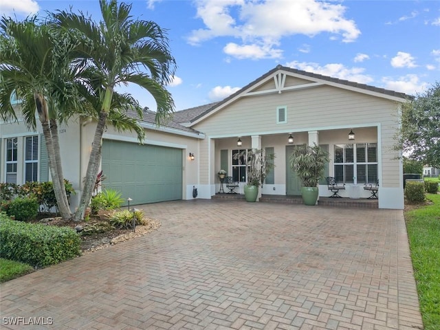 view of front facade with a porch and a garage