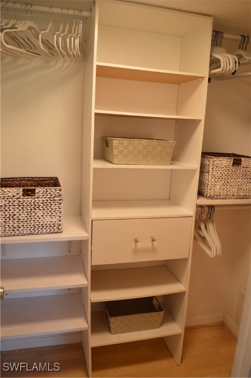 spacious closet featuring light wood-type flooring