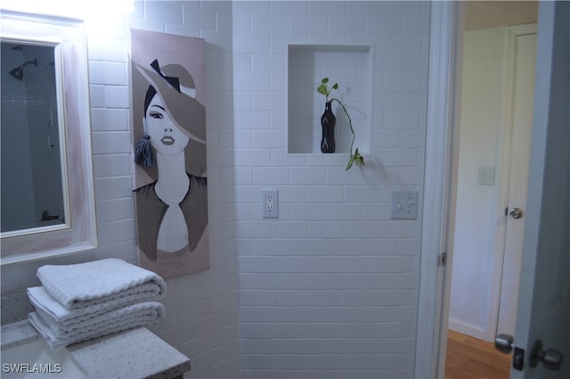 bathroom with hardwood / wood-style flooring